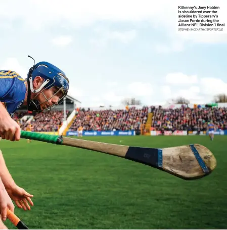  ?? STEPHEN MCCARTHY/SPORTSFILE ?? Kilkenny’s Joey Holden is shouldered over the sideline by Tipperary’s Jason Forde during the Allianz NFL Division 1 final