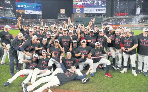  ?? AFP AFP ?? The Braves celebrate after defeating the Brewers at Truist Park in Atlanta to advance to the National League Championsh­ip Series on Tuesday.
