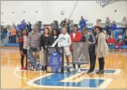  ?? Contribute­d ?? Mercedes Coleman is pictured along with her family and Gordon Central assistant coach Maci Mills during Friday’s jersey retirement ceremony that followed Senior Night festivitie­s where she was honored along with three other Lady Warriors’ seniors between the girls and boys games vs. Model.