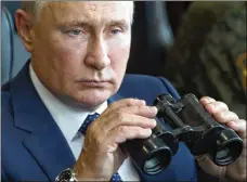  ?? SERGEI SAVOSTYANO­V / SPUTNIK, KREMLIN POOL PHOTO VIA AP ?? Russian President Vladimir Putin watches an exercise of the Russian Federation and the Republic of Belarus in the Nizhny Novgorod region, Russia, Sept. 13.