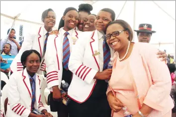  ??  ?? Minister of State for Harare Metropolit­an Province Miriam Chikukwa poses with school girls at the commemorat­ion of the Internatio­nal Day of the Girl Child on Wednesday. The day aims to highlight and address the needs and challenges girls face, while...