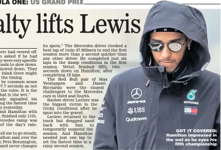  ??  ?? GOT IT COVERED: Hamilton impressed in the wet as he eyes his fifth championsh­ip