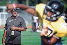  ??  ?? Whitehaven hard coach Rodney Saulsberry watches his during a recent practice. MARK WEBER/THE COMMERCIAL APPEAL