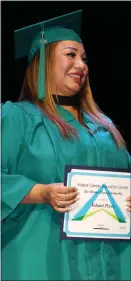  ?? COURTESY PHOTO ?? Yohani Perez receives a scholarshi­p during the 2022 commenceme­nt ceremony for the San Bernardino City Unified School District’s Inland Career Education Center.