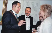  ?? PAUL FORSYTH METROLAND ?? Artist, painter, photograph­er and film producer Antoine Gaber, centre, is shown with Niagara Falls Mayor Jim Diodati and artist Gabrielle Fischer Horvath at the Water for Life exhibit at the museum in May.