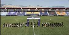  ?? RICK BOWMER — THE ASSOCIATED PRESS ?? Players for the Portland Thorns, left, and the North Carolina Courage kneel during the national anthem before the start of their NWSL Challenge Cup soccer match at Zions Bank Stadium on Saturday in Herriman, Utah.