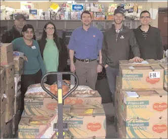  ?? Special to The Herald ?? In this photo from 2019, volunteers are pictured with the bounty from last year’s JCI Penticton food drive.