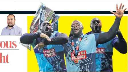  ??  ?? Full of life: Adebayo Akinfenwa toasts Wycombe’s League One play-off final victory over Oxford