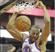  ?? DAVID J. PHILLIP— ASSOCIATED PRESS ?? Andre Iguodala of the Warriors dunks in the first half of Thursday’s win over the Rockets.