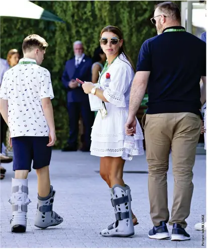  ?? ?? Best foot forward: Wayne Rooney with Coleen and son Kai, who both wore surgical boots