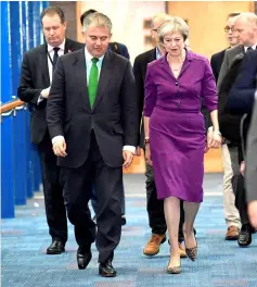  ??  ?? May walks through the conference centre on the third day of the Conservati­ve Party Conference in Birmingham, Britain. — Reuters photo