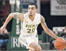  ?? Hans Pennink / Times Union archive ?? Roman Penn said his time at Siena, when the Saints went 8-24, has given him some perspectiv­e on how difficult it is to win in college basketball. “I’m happy I went through that because it made me tougher and made me stronger.” he said.