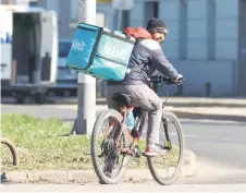  ?? ?? A Nepali worker delivers food for Wolt on a bicycle, in Zagreb, Croatia.