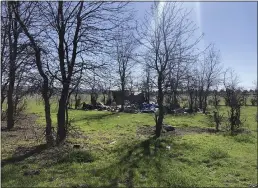  ??  ?? A camp site is seen on city property Thursday in Chico next to land owned by Ed McLaughlin, who said the campers have been there about three years. McLaughlin said he
has offered adjacent property he co-owns to the city of Chico for sanctioned camping.