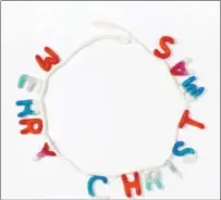  ?? PHOTO COURTESY OF WEST ELM ?? This ombre felt garland carries the simple message of the season from West Elm, $29.
