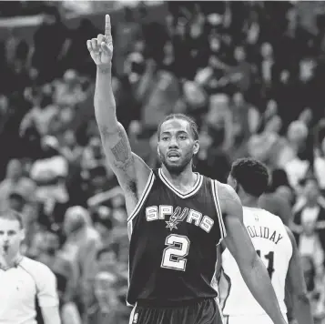  ?? DERICK E. HINGLE, USA TODAY SPORTS ?? Kawhi Leonard and the Spurs were on a seven- game winning streak going into Monday and clinched a playoff spot Saturday, marking 20 consecutiv­e seasons they have made the playoffs.
