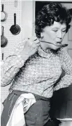  ??  ?? Julia Child in her kitchen in 1978, near the pegboard where she hung pots.