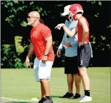  ?? GRAHAM THOMAS SPECIAL TO THE ENTERPRISE-LEADER ?? Farmington head football coach J.R. Eldridge watches a play develop while rising sophomore quarterbac­k Cameron Vanzant talks to an assistant coach during the Stateline Shootout 7-on-7 football tournament hosted by Siloam Springs Saturday.