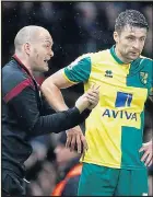  ??  ?? HE WILL GET US BACK UP: Norwich manager Alex Neil and captain Russell Martin