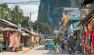  ?? 123RF ?? Tricycles and people rub along famously in the main street of El Nido.