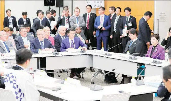  ??  ?? Top IOC official John Coates (center left), and Tokyo Governor Yuriko Koike (right), attend a meeting to assess progress on the Tokyo 2020 Olympic Games in Tokyo on Nov 1. Next year’s Olympic marathons and race walks will be run in the northern city of Sapporo as the IOC followed through Friday with a controvers­ial plan to move from Tokyo to the cooler northern city. (AP)