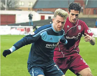  ??  ?? Jassem Sukar challenges Forfar’s Josh Peters during February’s derby clash at Gayfield.