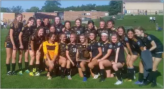  ?? MICHAEL J. WALLWORK — FOR MEDIANEWS GROUP ?? The Clarkston Everest Collegiate/Academy of the Sacred Heart soccer team poses with its Division 4 district championsh­ip trophy after beating Orchard Lake St. Mary’s, 2-0, in the district title game at Auburn Hills Oakland Christian on Friday.