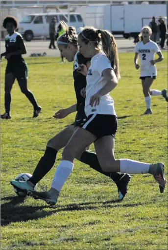  ?? Haley Sawyer/The Signal ?? Canyon’s Cynthia Valdez (left) fights to keep control of the ball against a Pacifica player in a CIF-SS Division 2 quarterfin­al game on Friday at Pacifica. Canyon lost the game 1-0.