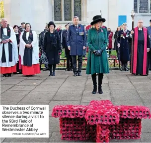  ?? FRANK AUGSTEIN/PA WIRE ?? The Duchess of Cornwall observes a two minute silence during a visit to the 93rd Field of Remembranc­e at Westminste­r Abbey