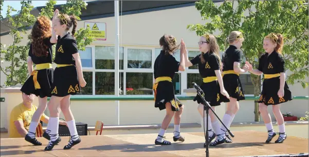  ??  ?? Some of the pupils performing some Irish dancing at the official opening of the extension at Monamolin National School