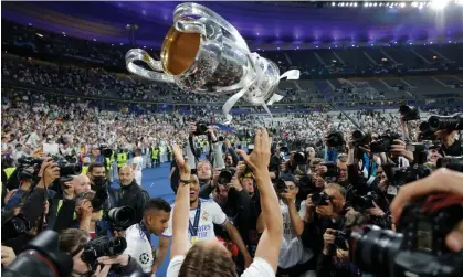  ?? ?? Real Madrid’s Luka Modric celebrates with the Champions League trophy in Paris last May. Photograph: Tom Jenkins/The Guardian