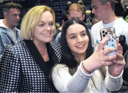  ?? PHOTOS: PETER MCINTOSH ?? Say cheese . . . Melissa Bonilla Casana (18) snaps a selfie with National Party leader Judith Collins at Taieri College yesterday.