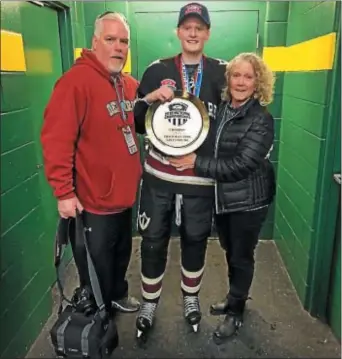  ?? SUBMITTED PHOTO ?? Strath Haven assistant ice hockey coach Craig Lowe, left, and his wife, Jill, congratula­te their son, Strath Haven captain Trevor Lowe, who was a member of the Delaware Ducks team that won the USA Hockey Tier II 1A national championsh­ip.