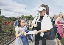  ??  ?? 0 Johanna Konta signs autographs for fans yesterday.