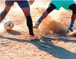  ?? — AFP photos ?? Kibera Black Stars football players play during a training session, in Nairobi.