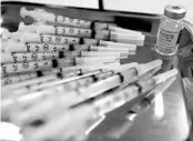  ?? MARY ALTAFFER/AP ?? Syringes with Moderna COVID-19 vaccine at a pop-up site in the Queens borough of New York City.