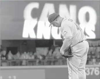  ?? THE ASSOCIATED PRESS ?? New York Mets pitcher Bartolo Colon composes himself on the mound after Seattle Mariners second baseman Robinson Cano singled to break up Colon’s up-to-then perfect game in the seventh inning Wednesday in Seattle.