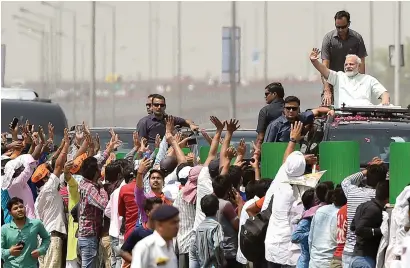  ?? PTI ?? Prime Minister narendra Modi waves during the roadshow, after inaugurati­ng the Delhi-Meerut expressway, in east Delhi, on sunday. —