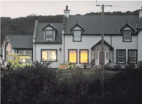  ??  ?? The house at Whitepark Road in Ballycastl­e where the fire happened and (right) Sinead Stewart with her husband Ali on their wedding day in 2015