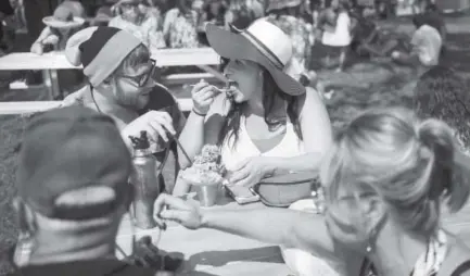  ?? Special to The Denver Post ?? Deidre Cordova enjoys a snow cone at A Taste of Colorado on Saturday. Photos by Daniel Brenner,