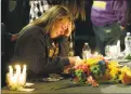  ?? Ted S. Warren / Associated Press ?? A young woman holds her head in her hand in Marysville, Washington, Oct. 24, 2014, after a memorial vigil held for people affected by a shooting at Marysville Pilchuck High School.