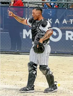  ?? ?? Black Sox catcher Te Wera Bishop calling the shots during the Softball World Cup in Auckland.