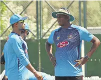  ?? Photo by Shihab ?? Bangladesh coach Courtney Walsh (right) has a word with captain Mashrafe Mortaza during the practice session. —