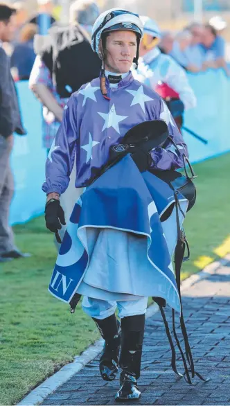  ?? Picture: MIKE BATTERHAM ?? Dan Griffin amazingly walks back to the jockeys room after having his neck crushed in the barriers (inset) at the Gold Coast.