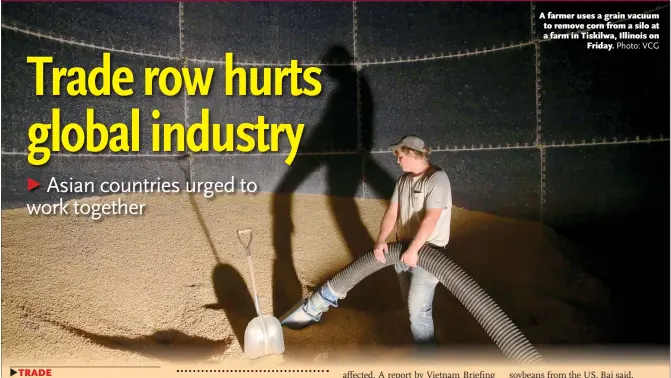  ?? Photo: VCG ?? A farmer uses a grain vacuum to remove corn from a silo at a farm in Tiskilwa, Illinois on Friday.