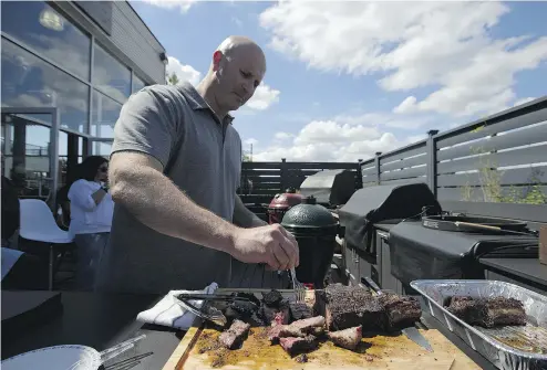  ?? CHRISTINNE MUSCHI PHOTOS FOR NATIONAL POST ?? Urban Bonfire founder Ryan Bloom says hosting cooking classes for clients is one way the outdoor cooking boutique stands apart from its competitio­n. But where it really does well is in designing outdoor kitchens.