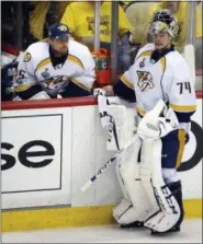  ?? GENE J. PUSKAR — THE ASSOCIATED PRESS ?? Nashville Predators goalie Pekka Rinne, left, sits on the bench after being replaced by Juuse Saros, right, during the third period in Game 2 of the team’s NHL hockey Stanley Cup Final against the Pittsburgh Penguins on Wednesday in Pittsburgh. The...