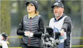  ?? Picture / AP A cold Lydia Ko, with caddie Jonny Scott, is on top of her game at Lake Merced. ??