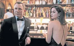  ?? NICOLA DOVE DANJAQ LLC AND MGM ?? James Bond (Daniel Craig) and Paloma (Ana de Armas) in the newest Bond film, “No Time to Die.” Rather than a female take on Bond, Craig wants to see better parts for women and actors of colour, a change from his attitude two years ago.