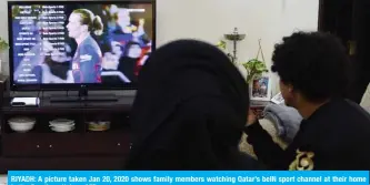  ??  ?? RIYADH: A picture taken Jan 20, 2020 shows family members watching Qatar’s beIN sport channel at their home in the Saudi capital. — AFP